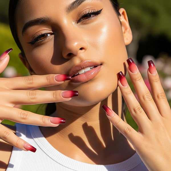 Close-up of elegant burgundy ombre coffin nails using SAVILAND gel polish for salon-quality nail art at home