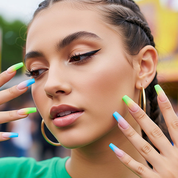 Model wearing colorful blue and green French tip coffin nails created with SAVILAND gel nail polish collection
